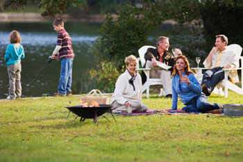 People relaxing near their Norfolk Holiday Lodge